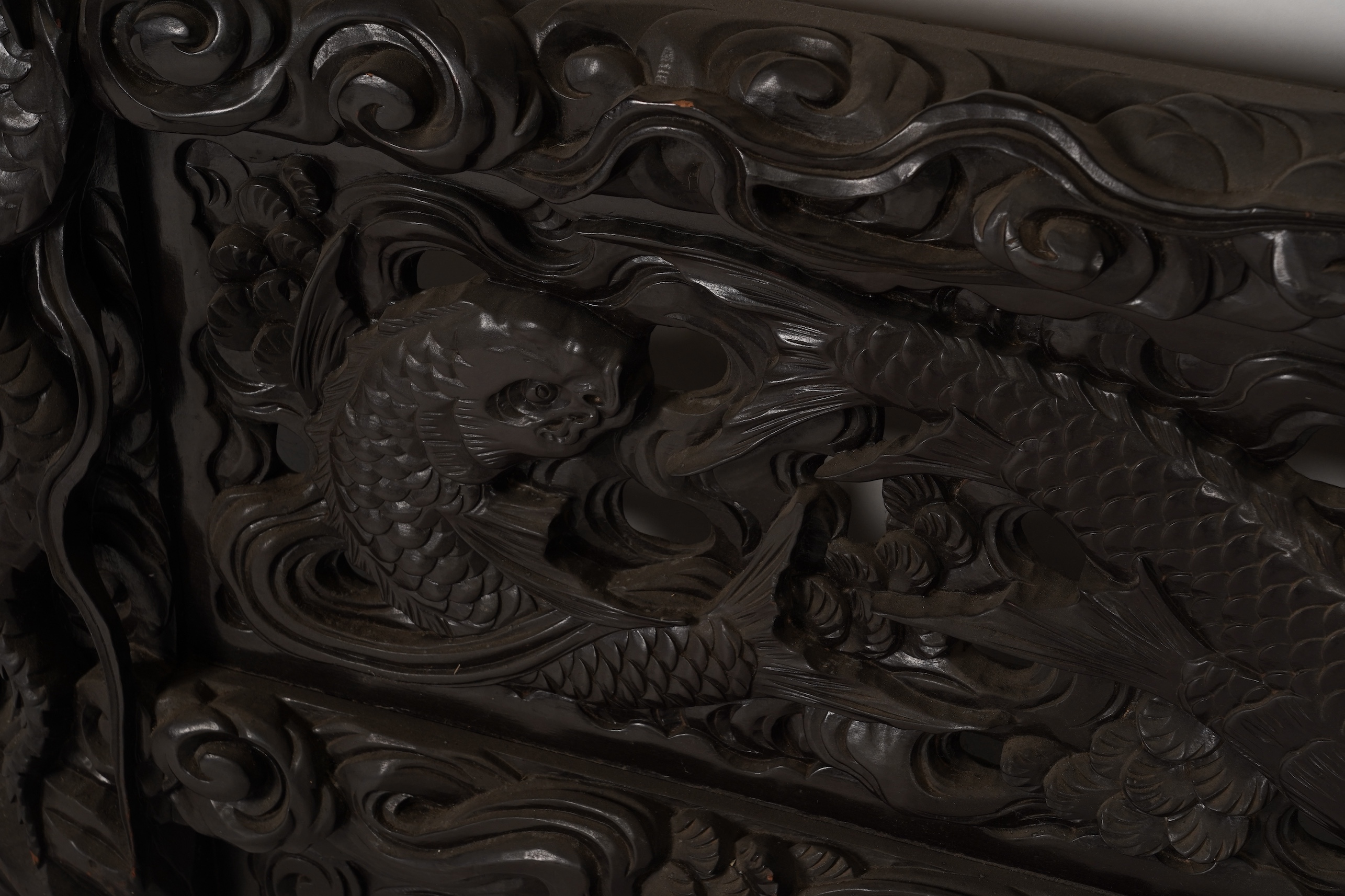 A pair of large Japanese carved hardwood ’dragon’ screen frames, Meiji period